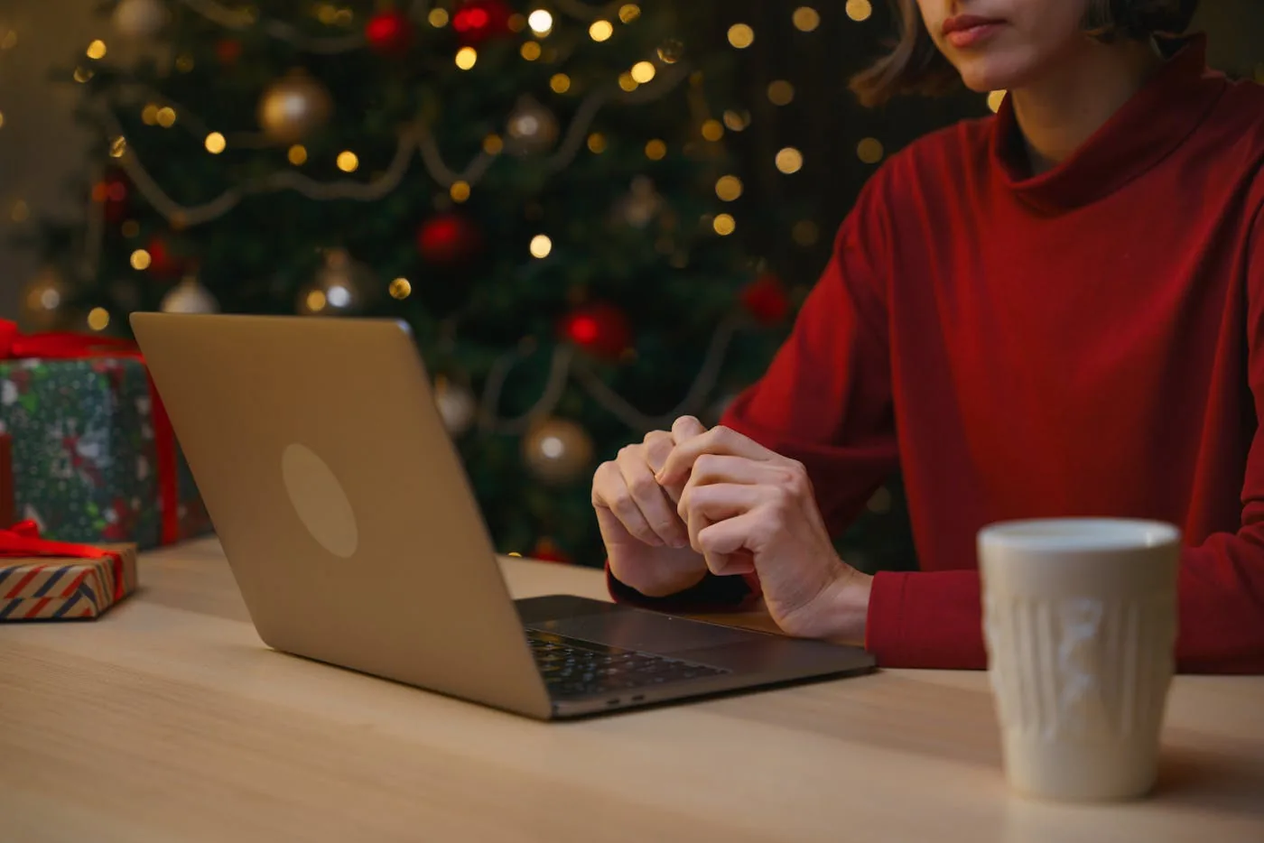 Shopify merchant managing Christmas orders on laptop with holiday decorations — final countdown playbook