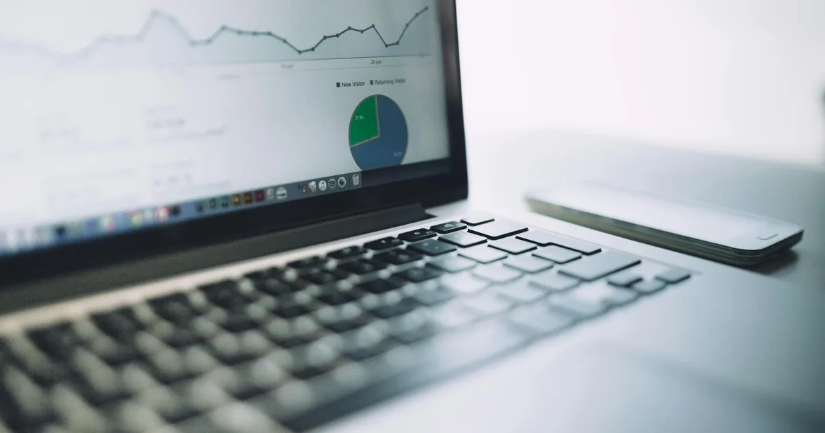 Laptop displaying a clean business analytics dashboard — WeIntegrate routes Shopify orders to a single default QuickBooks Online customer