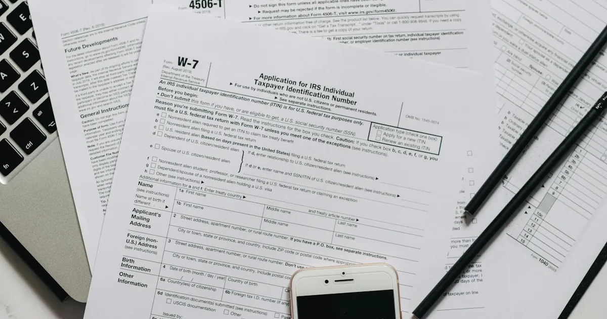 Person reviewing sales tax liability data on laptop at a clean business desk — Shopify marketplace sales tax account in QuickBooks Online payout deposit